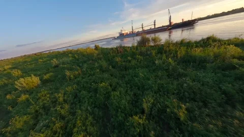 Cargo ship during golden sunset light Vídeo Stock 329240320