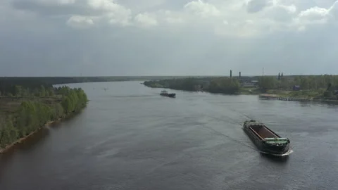 Cargo ship. An empty barge for transporting timber or sand floats on the river Video stock 155184746