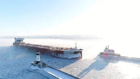 Cargo Ship Entering Port in Duluth, MN in Winter Stock Footage 99991396