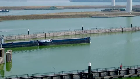 Cargo ship exits the Krammer locks, in The Netherlands. 스톡 동영상 275278691