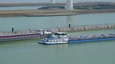 Cargo ship exits the Krammer locks, in The Netherlands. 스톡 동영상 275286617