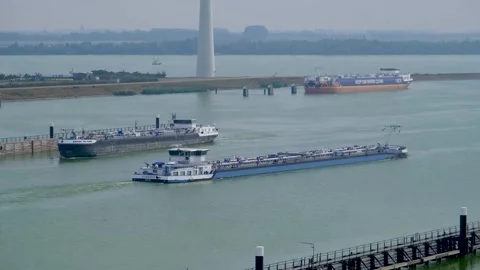Cargo ship exits the Krammer locks, in The Netherlands. 스톡 동영상 275808216