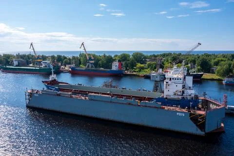Cargo ship at floating dry dock is being renovated Stock Photos