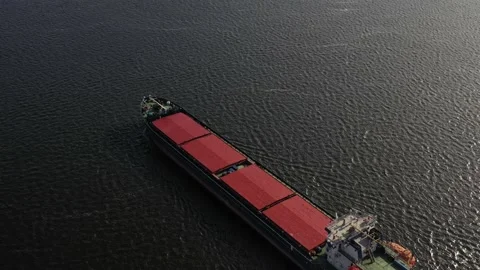 The cargo ship is floating on the river. Video stock 133042135