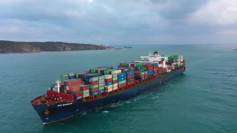Cargo ship full of container stacks heading towards Bosporus at dawn Stock Footage 252588408