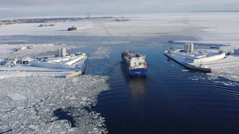 Cargo ship goes through the dam to the port, iced sea Stock Footage 170384966