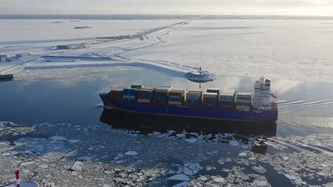 Cargo ship goes through the dam to the port. Aerial view Video stock 170384968