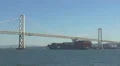 Cargo ship going under the Oakland Bay Bridge 4k or 4k+ Resolution