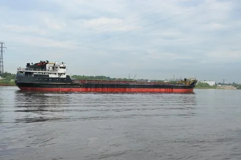 Cargo ship, large ship, cargo ship is on the river. Port city Stock Photos