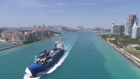 Cargo Ship leaving government cut in Miami Beach Stock Footage
