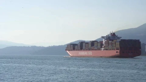 Cargo ship leaving harbor 4k Stock Footage 99647527