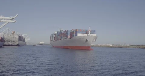 Cargo Ship Leaving Port Stock Footage 99869703