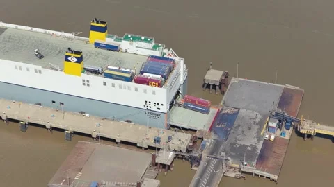 The cargo ship Leonine docked today as a truck moved a shipping container from Video stock 345682030
