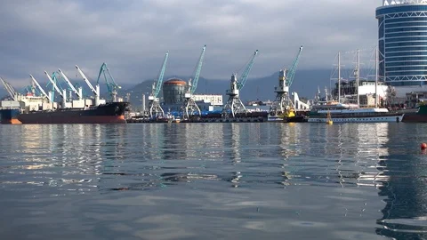 Cargo ship-lifting cranes in the harbor Stock Footage 102849825