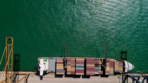 Cargo ship loaded with containers in the port aerial close up Video stock 79177249