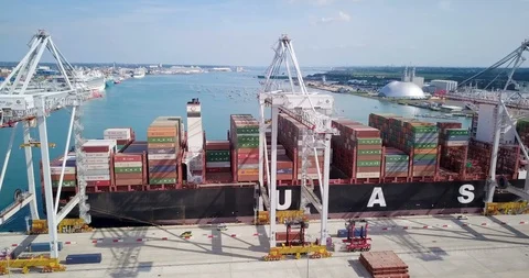 Cargo ship loading and unloading with shipping containers Stock Footage 89700730