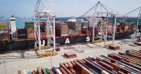 Cargo ship loading and unloading with shipping containers Stock Footage 89719377