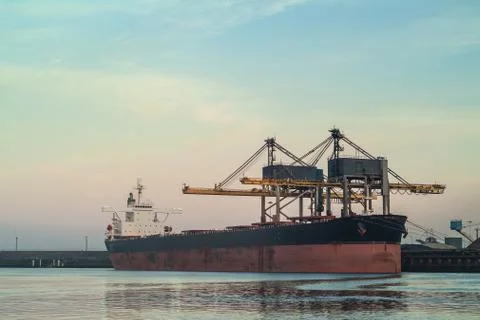 Cargo ship loading with coal in the netherlands Stock Photos