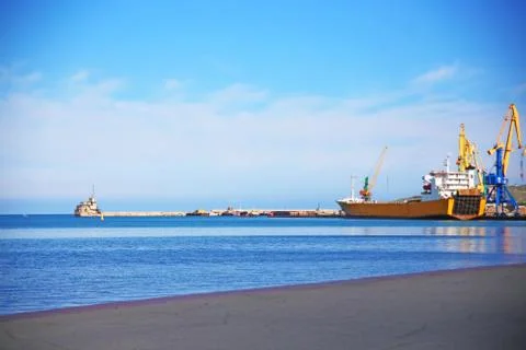 Cargo ship loading containers Stock Photos
