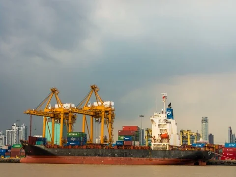 Cargo ship loading by crane at shipping port. time lapse Stockbeeldmateriaal 80487656