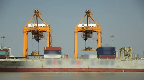 Cargo ship loading goods container at shipping port Video stock 60205438