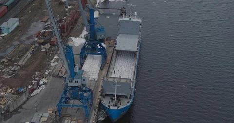 Cargo ship loading into the holds. Aerial Survey Stock Footage 105111163