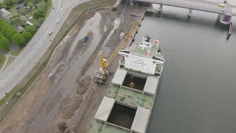 Cargo Ship Loading Multiple Shipping Containers from semi 動画素材 209617330