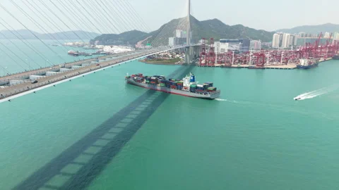 A Cargo Ship Maneuvering Through a Lively Harbor, Emphasizing the Complexities Stock Footage 316663689