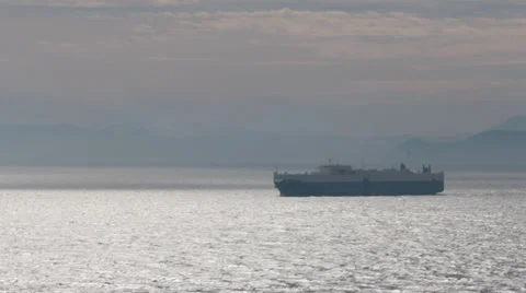 Cargo ship in the mediterranean sailing in the evening sun Stock Footage 36778676