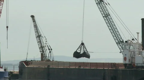 Cargo ship moving load at port Stock Footage 374270