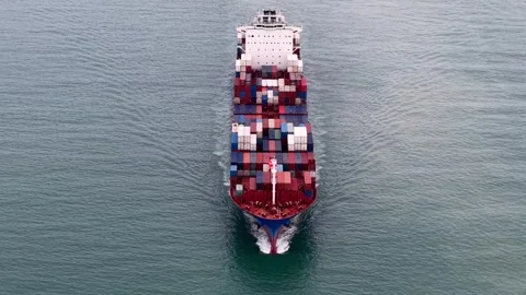 Cargo Ship Navigating Calm Open Water with Vibrant Colored Containers Stock Footage 340831258