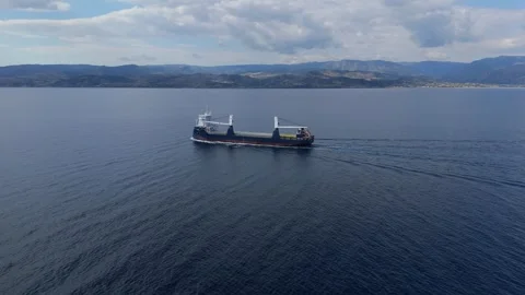 Cargo ship navigating calm waters, aerial view Stock Footage 335645917