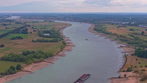 Cargo ship navigating the rhine river during severe drought in germany Видео 345026930