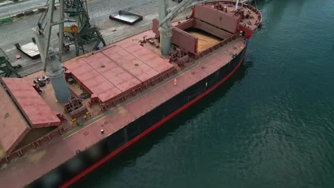 Cargo ship or bulk carrier loaded to the brim with grain is preparing for Stock Footage 252140411