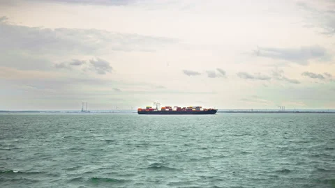 A cargo ship or freighter carries goods and materials from one port to another. Stock Footage 153876414
