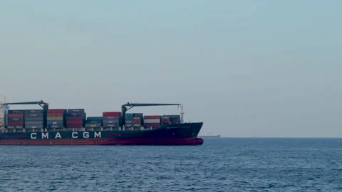 A cargo ship passes at sea Stock Footage 151723849