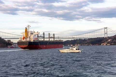 A cargo ship passes through the Bosphorus Strait in Turkey Stock Photos