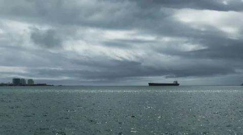 Cargo Ship Passes by the Town Stock Footage 41687279