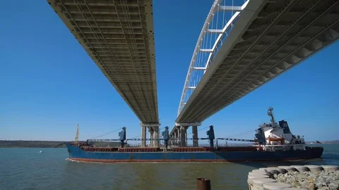 Cargo Ship Passes Under the Crimean Bridge in Kerch Stock Footage 104654980