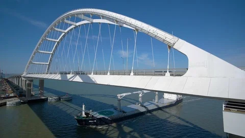 Cargo Ship Passes Under the Crimean Bridge in Kerch Stock Footage 104662823