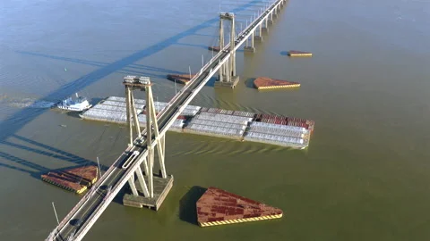 Cargo ship passing under the General Belgrano Bridge over the Paraná River in Stock-Footage 320978414