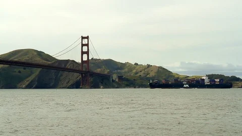 Cargo ship passing underneath Golden Gate Bridge in San Francisco, California, Stock Footage 88342422