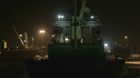 Cargo Ship in Port at Night Stock Footage 67565242