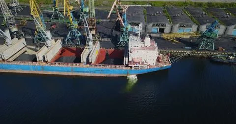 The Cargo Ship is in the Port Pier at the Loading of Coal Stock Photos