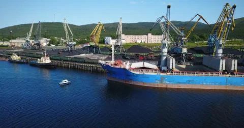 The Cargo Ship is in the Port Pier at the Loading of Coal Stock Photos
