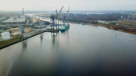 Cargo ship in port terminal flyover Stock Footage 122235596