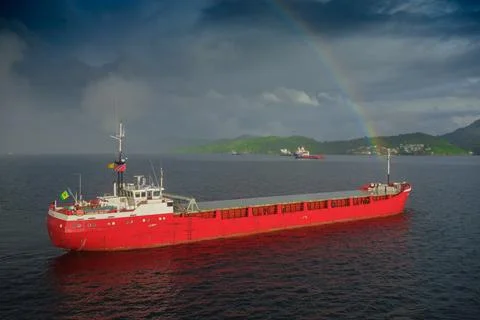 Cargo ship in rainbow Stock Photos