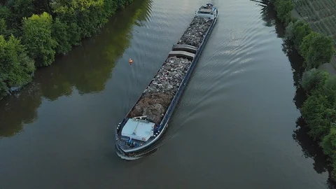 Cargo Ship on a river at sundown in between vineyards and forest Stock Footage 90663083