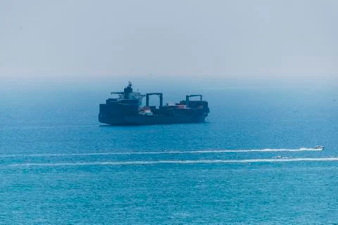 Cargo ship in the roadstead Stock Photos