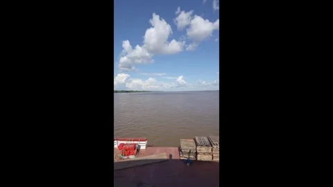 Cargo ship sailing in Amazonas river in the Amazon rainforest landscape.  Stock Footage 280205085